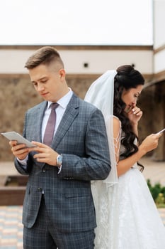 the first meeting of the bride and groom in the courtyard of the hotel photo