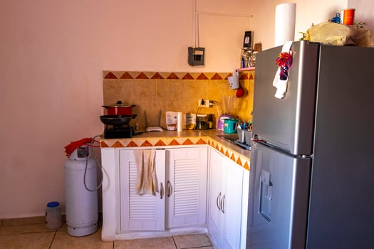 Playa del Carmen Quintana Roo Mexico 2021 Simple small apartment hotel room with bed table in Mexico. photo