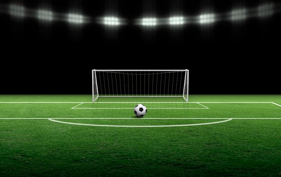 ball on green field in soccer field ready for game play photo