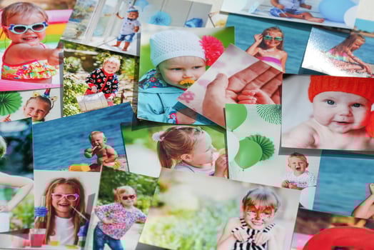Printed photographs of children. A huge amount of printed materials. photo