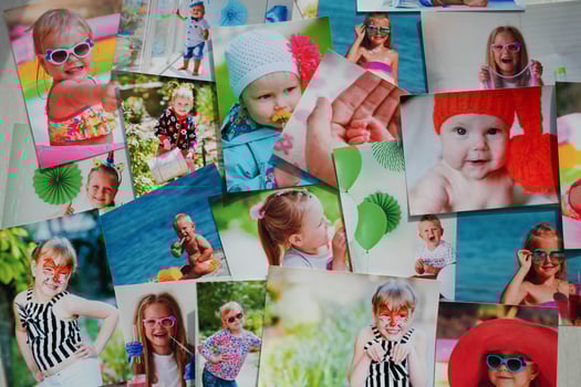 Printed photographs of children. A huge amount of printed materials. photo