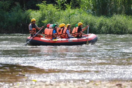 NAKHONNAYOK, THAILAND,DECEMBER 19  Group of adventurer doing white water rafting at dam, on December 19, 2015,The river is popular for its scenic nature view. photo