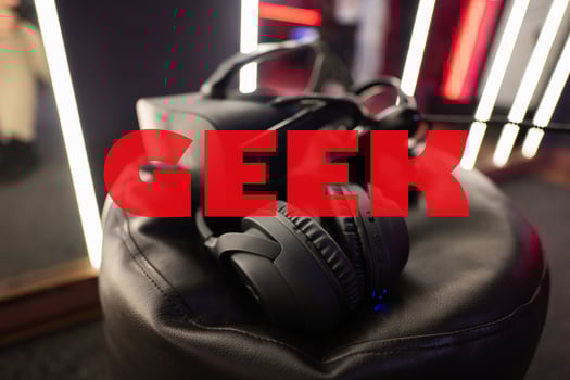 Geek concept. Professional headphones with microphone and vr glasses for video games and cyber sports on background. photo