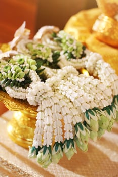 Flower garlands on a gold tray in tradition Thai wedding ceremony day. Jasmine garland. photo