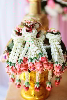 Flower garlands on a gold tray in tradition Thai wedding ceremony day. Jasmine garland. photo