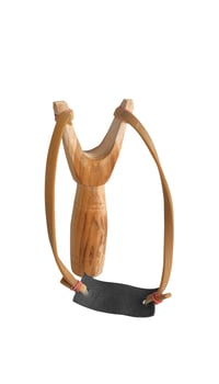 Homemade slingshot or catapult, playing tool for kid on white background. photo