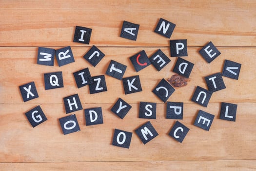 English alphabet letters on wood table. photo