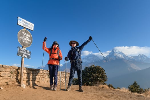 A young traveller trekking in Poon Hill view point in Ghorepani, Nepal photo