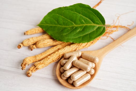 Ginseng roots and green leaf, healthy food. photo