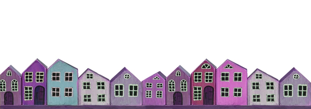 Wooden toy purple houses on a white background. Banner miniature town. photo
