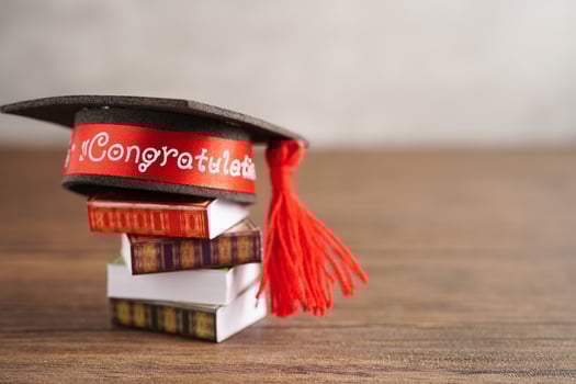 Graduation hat on book with copy space, learning university education concept. photo