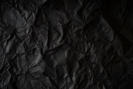 Design space black and dark crumpled paper textured background. photo