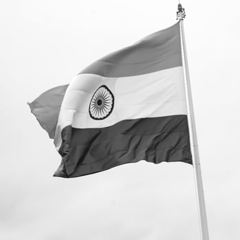India flag flying high at Connaught Place with pride in blue sky, India flag fluttering, Indian Flag on Independence Day and Republic Day of India, tilt up shot, Waving Indian flag, Har Ghar Tiranga photo