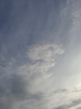 Beautiful white clouds on deep blue sky background. Large bright soft fluffy clouds are cover the entire blue sky. photo