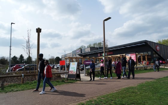 Low Angle View of Willen Lake Park with Local and Tourist Public Enjoying the Beauty of Lake and Park by Walking Around with Their Families. Footage Was Captured on 09-April-2023 at Milton Keynes UK photo
