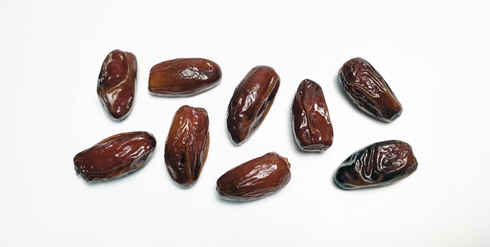 Close up of dried dates fruit isolated on white background photo