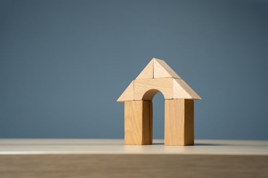 House with arch door with wooden blocks. Buying and selling housing. Design and architectural services. Property insurance. Real estate market review. Construction industry photo