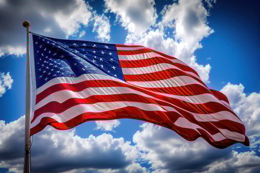 The national flag of the United states on blue sky with clouds. Happy Labor Day. photo
