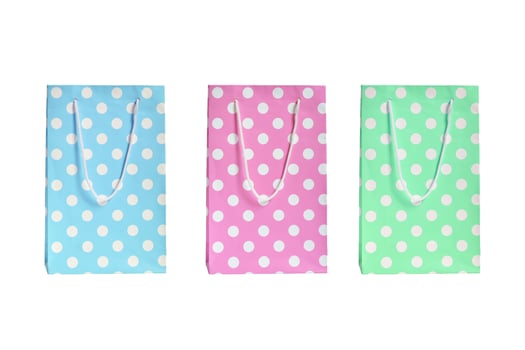 gift bags with handles blue pink and green on a white background photo