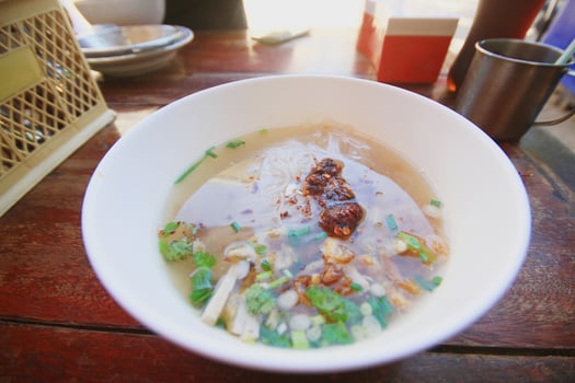 Delicious traditional Pork Spare Ribs Rice Noodles Soup.Vietnamese noodle soup in white bowl. photo