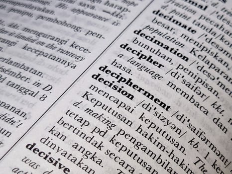 Surabaya, indonesia - april, 2023 - a close up of the word decision in the English to Indonesian dictionary. For language background or wallpaper photo