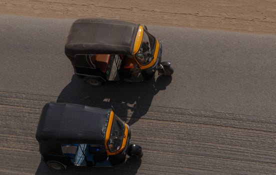 two tuk-tuks on street of Cairo, Egypt photo