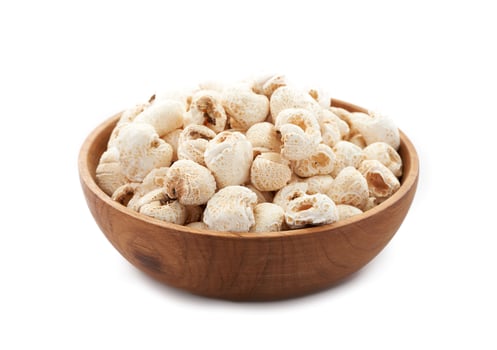 traditional Korean popcorn or Gangnange in wood bowl isolated on white background photo