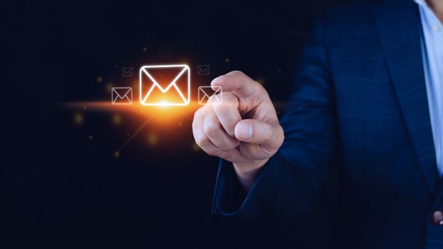 Businessman holding checking email online with virtual interface technology.Direct marketing, online message, E-mail, electronic mail,communication concept. photo