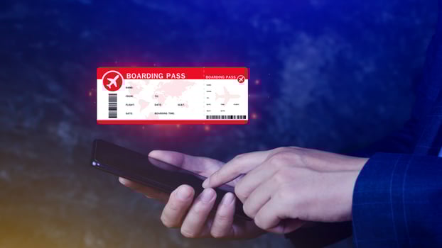 Hand holding boarding pass tickets air travel concept, Choosing checking electronic flight ticket on smartphone. photo
