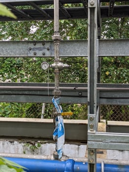 Pressure gauge of pressure sustaining valve for service air on power plant project. The photo is suitable to use for industry background photography, power plant poster and electricity content media.