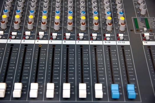 Audio sound mixer console. Music mixer control panel in a recording studio. Audio mixing console with faders and adjusting knob. photo