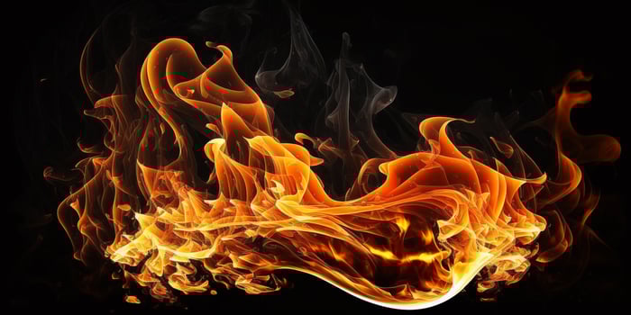 Fire flames on black background photo