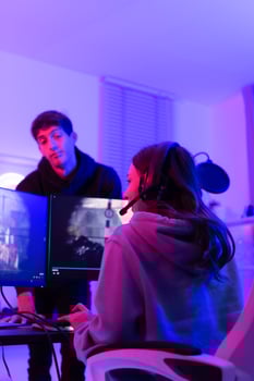 The mood of people waiting to play games when there is only one computer. When the game is over, it's time to switch players. photo