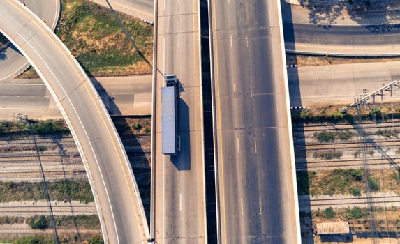 Aerial view of cargo Truck on highway road with blue container, transportation concept.,import,export logistic industrial Transporting Land transport on the asphalt expressway photo