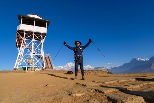 A young traveller trekking in Poon Hill view point in Ghorepani, Nepal photo