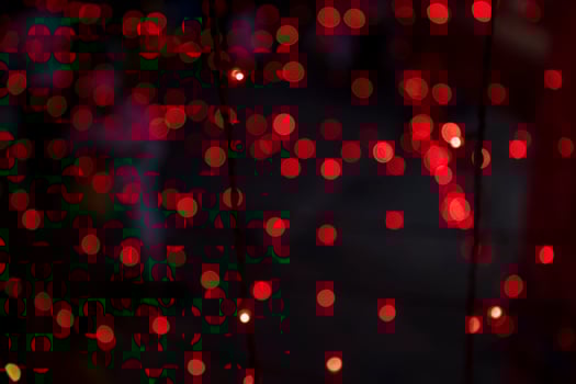 Red Defocus Abstract bokeh light effects on the night black background texture photo