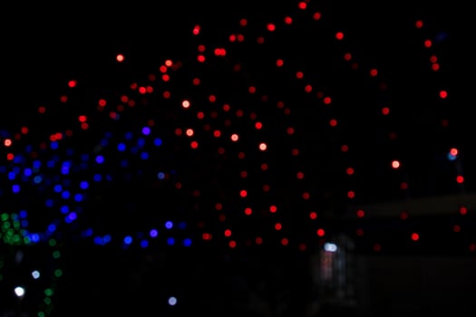 Colorful Defocus Abstract bokeh light effects on the street night black background texture wallpaper photo