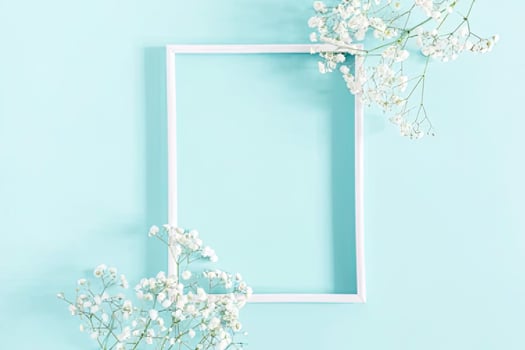 Flowers composition romantic. flowers, photo frame on pastel blue background. Valentine's Day, Easter, Birthday, Happy Women's Day, Mother's day. Flat lay, top view, copy space.