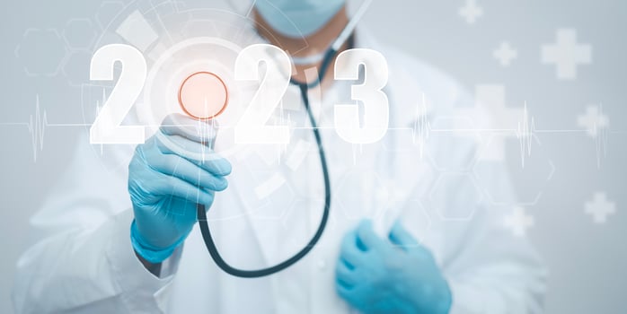 Concept New Year 2023 in medicine and healthcare, Doctor or scientist with a stethoscope Wearing Medical Mask in the white background, health insurance,medical secret, emergency online medical photo