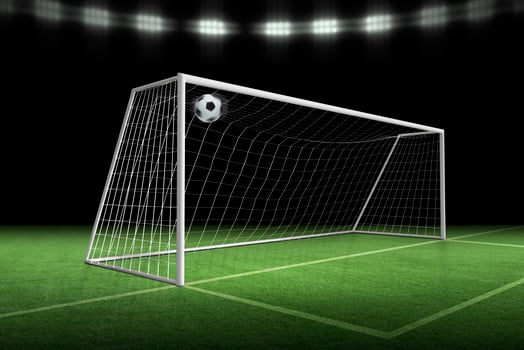 soccer ball in goal, spotlight background in stadium photo