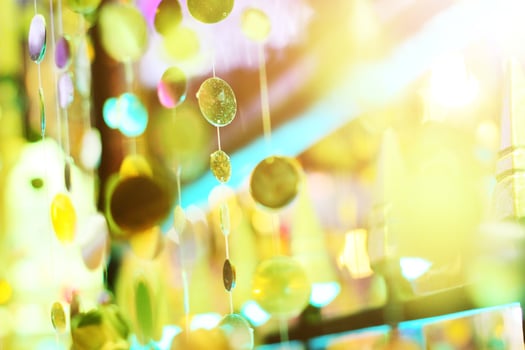 Glamour sparkling and purple glitter bokeh of golden metallic circle. Multicolored Christmas and New Year glowing light abstract for Christmas and holiday concept. photo
