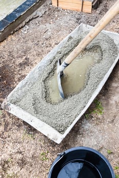 cement, sand and gravel mix in trough outdoors photo