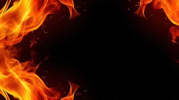 Fire flames on black background. Closeup of fire flames isolated on black background. photo