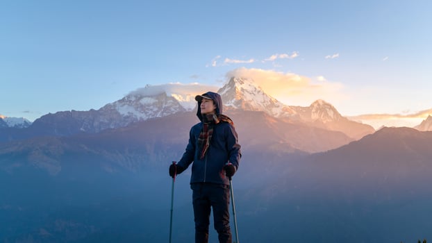 A young traveller trekking in Poon Hill view point in Ghorepani, Nepal photo