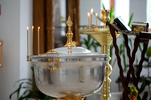 The interior of the church during the baptism of a child. Bath for baptism. photo