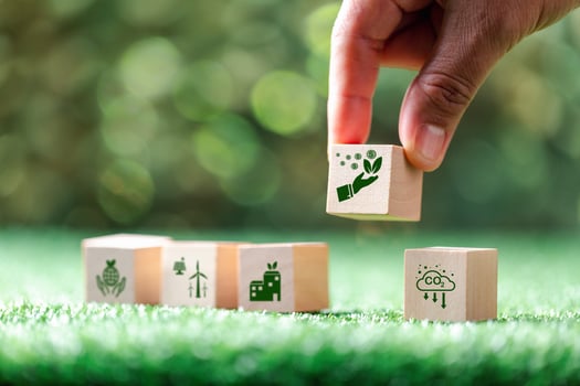 Companies are targeting net zero greenhouse gas emissions. Carbon credit concept.Tradable certificate to drive industry in direction of low emissions in efficiency cost.Wooden cubes with decrease CO2 photo