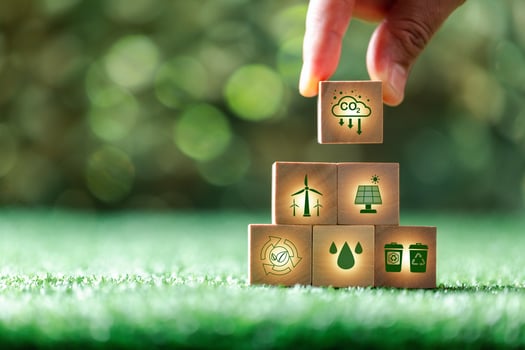 Companies are targeting net zero greenhouse gas emissions. Carbon credit concept.Tradable certificate to drive industry in direction of low emissions in efficiency cost.Wooden cubes with decrease CO2 photo