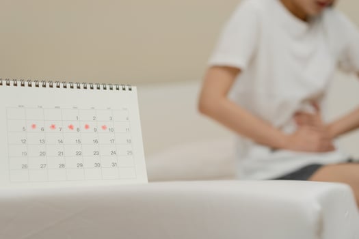 Menstruation, period cycle day of monthly, hurt asian young woman, female hand in stomachache, suffer from PMS premenstrual, belly or abdomen pain on bed at home. Health problem Inflammation in body photo