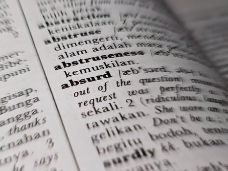 a close up of the word absurd in the English to Indonesian dictionary. For word background or wallpaper photo