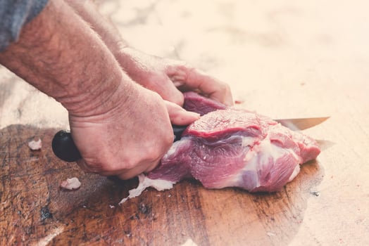Cutting red meat photo